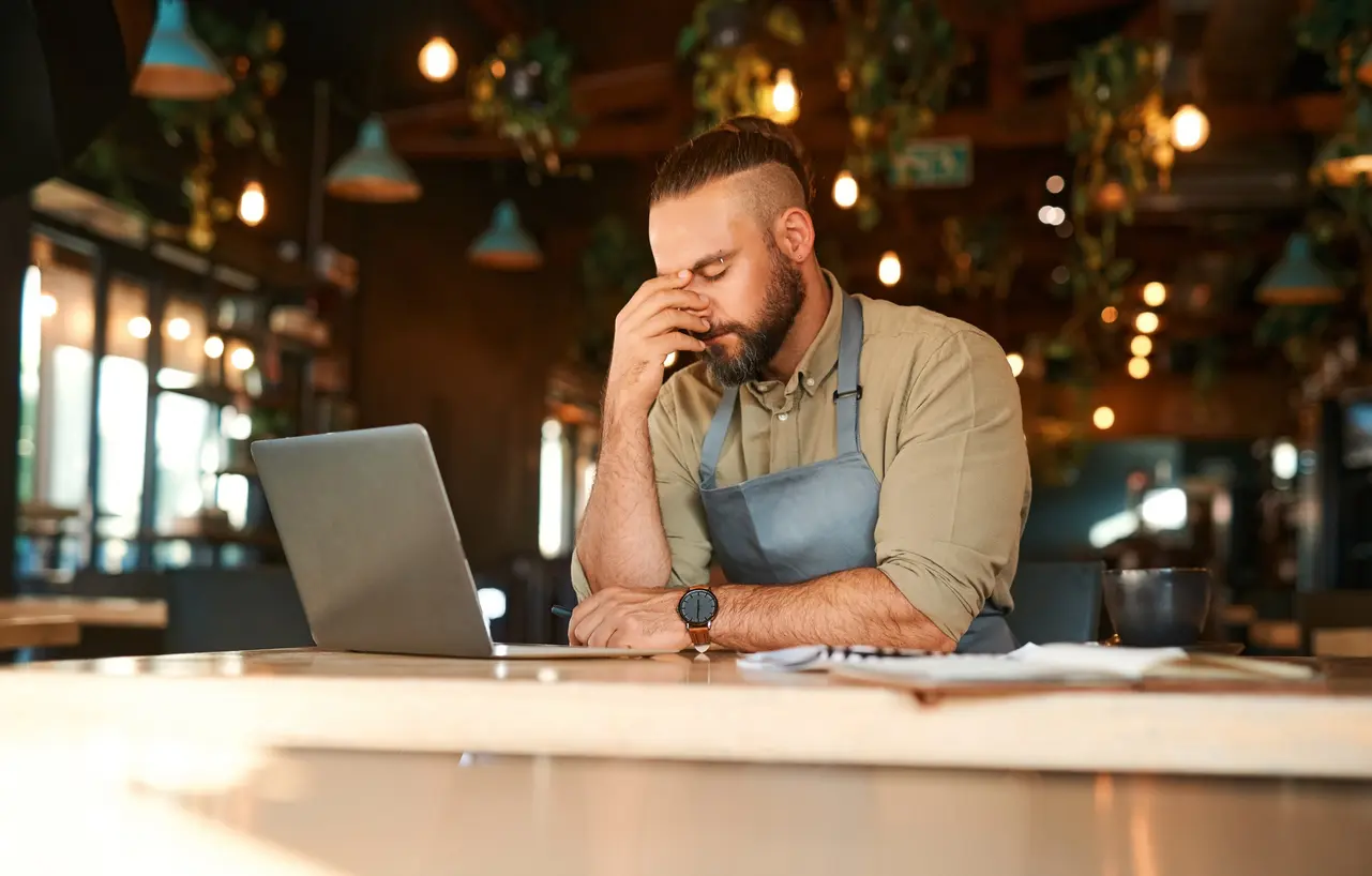 Restaurant manager reviewing kitchen operations